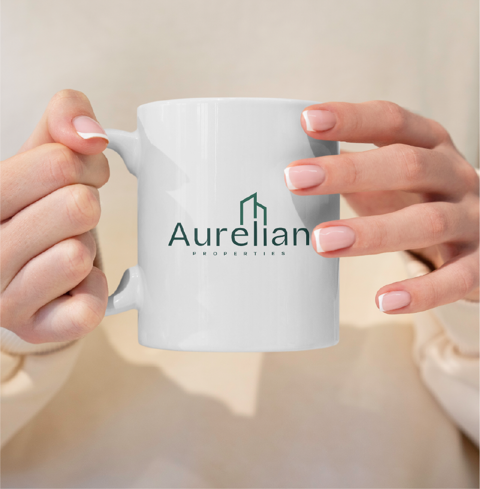 A branded mug for Aurelian Properties, extending the luxury brand experience through refined merchandise and timeless design.